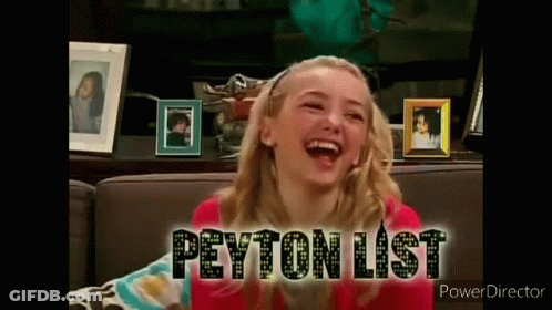 A Girl Is Sitting On A Couch Laughing And The Words Peyton List Are On The Screen Behind Her . GIF