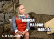 A Girl Is Sitting On A Couch With The Words Marcia GIF