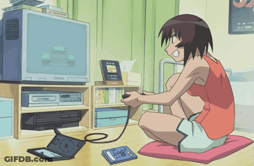 A Girl Is Sitting On The Floor Playing A Video Game With A Book Laying On The Floor That Says Dragon Ball GIF