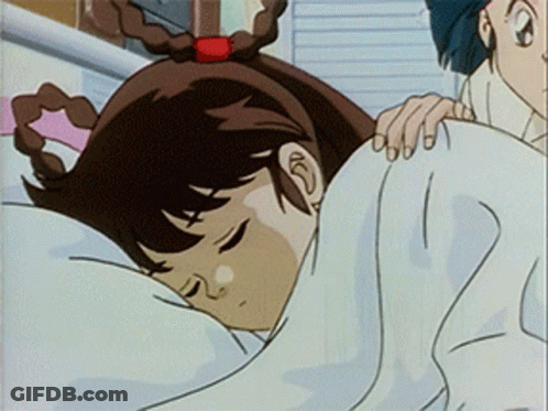 A Girl Is Sleeping In A Bed With A White Blanket On Her Head GIF