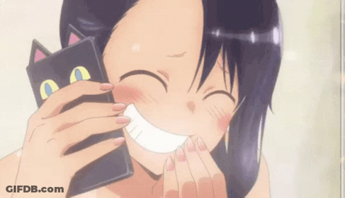 A Girl Is Smiling While Holding A Black Cat Shaped Wallet GIF