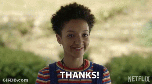 A Girl Is Smiling With The Words Thanks Written Above Her GIF