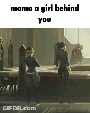A Girl Is Standing In Front Of A Table In A Room With A Group Of People . GIF