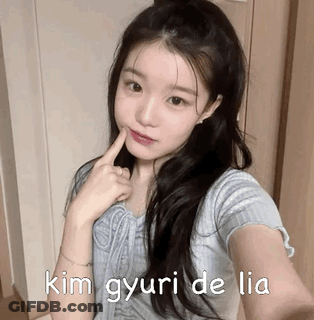A Girl Is Taking A Selfie With Her Finger In Her Mouth And The Words Kim Gyuri De Lia Written On The Bottom . GIF