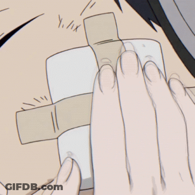 A Girl Is Touching A Boy 'S Face With Her Hand GIF