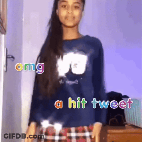 A Girl Is Wearing A Blue Shirt And Plaid Skirt And Says Omg A Hit Tweet GIF