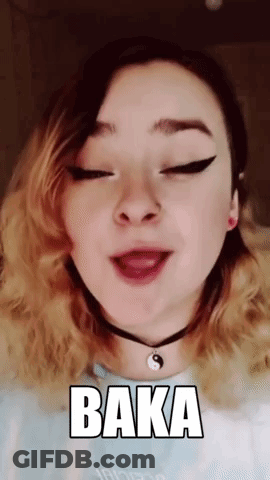 A Girl Is Wearing A Choker And Making A Funny Face With The Word Baka On Her Face . GIF