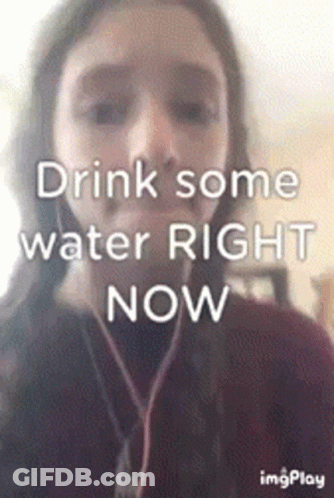 A Girl Is Wearing Headphones And Says Drink Some Water Right Now . GIF