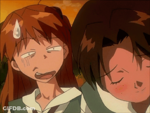 Girl Making Funny Face Next To Boy GIF