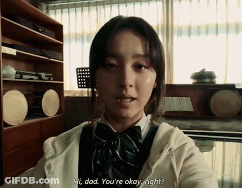 A Girl Says Hi Dad You 'Re Okay Right In Front Of A Window GIF