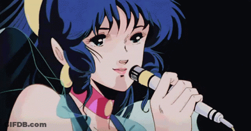 A Girl Singing Into A Microphone With Blue Hair GIF