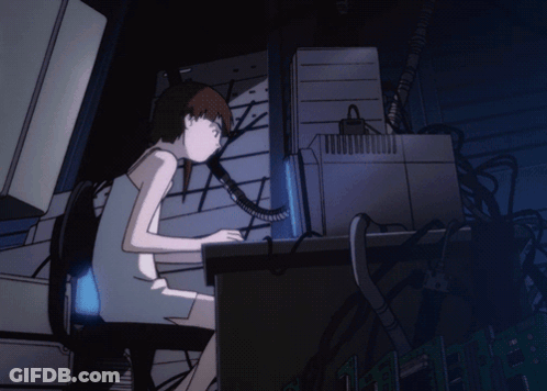 A Girl Sits At A Desk In Front Of A Computer Screen GIF