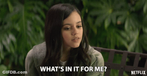 A Girl Sitting On A Bench With A Netflix Logo In The Background GIF