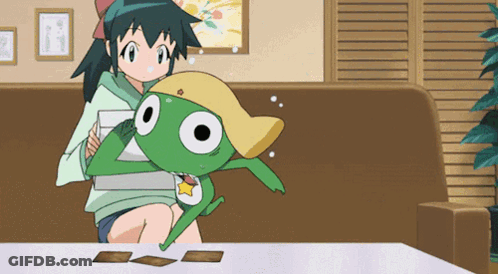 A Girl Sitting On A Couch Holding A Frog GIF