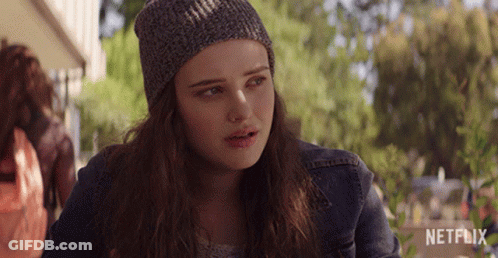 A Girl Wearing A Beanie And A Denim Jacket With Netflix Written On The Bottom GIF