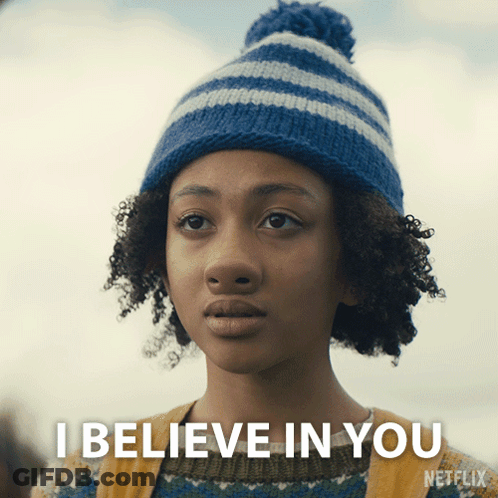 Girl In Blue And White Striped Hat And Sweater Saying I Believe In You GIF