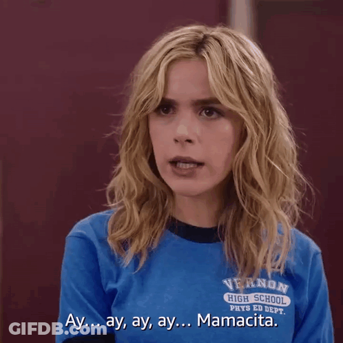 A Girl Wearing A Blue Shirt That Says Vernon High School On It GIF