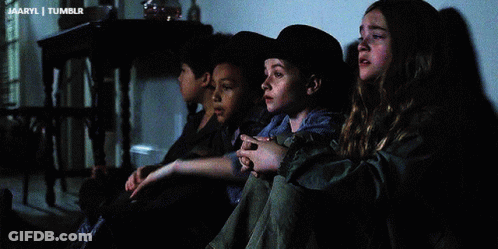 A Girl Wearing A Cowboy Hat Sits Next To A Boy GIF