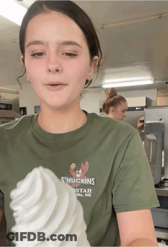 A Girl Wearing A Green Shirt That Says ' Huckings ' On It GIF