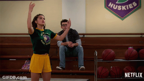 Girl In Green Huskies Shirt Playing Basketball GIF