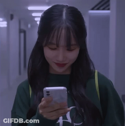 A Girl Wearing A Green Sweatshirt With The Letter N On It GIF