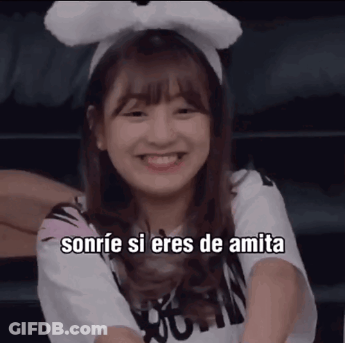 A Girl Wearing A Headband With Bunny Ears Smiles And Says Sonrie Si Eres De Amita . GIF