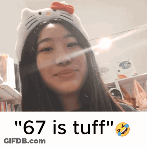 A Girl Wearing A Hello Kitty Headband With The Words " 67 Is Tuff " Next To Her GIF