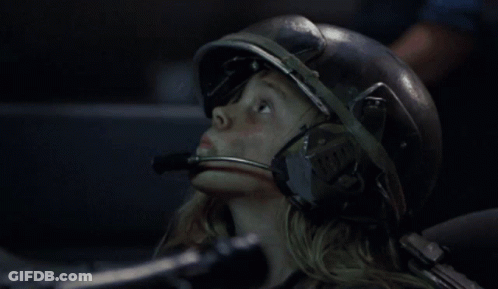 Girl With Helmet And Microphone Looking Up GIF