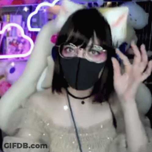 A Girl Wearing A Mask And Headphones Is Sitting In A Chair With A Cat Ear . GIF