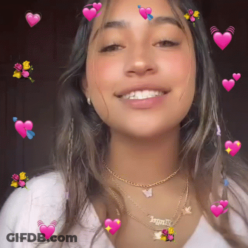 A Girl Wearing A Necklace That Says " Angel " GIF
