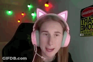 A Girl Wearing A Pair Of Pink Cat Ears Headphones With A Microphone . GIF
