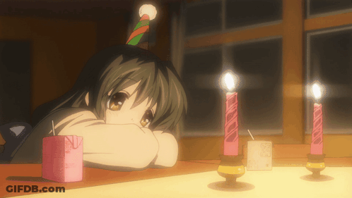 A Girl Wearing A Party Hat Is Looking At Candles GIF