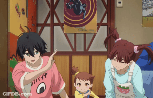 A Girl Wearing A Pink Shirt That Says Onigiri Is Standing Next To A Boy And A Little Girl GIF