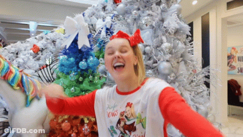A Girl Wearing A Shirt That Says Jingle Lowns GIF