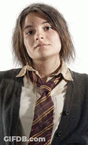 A Girl Wearing A Striped Tie And A Sweater Has A Tattoo On Her Face GIF