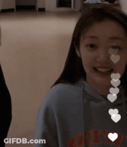 A Girl Wearing A Sweatshirt That Says NYC On It GIF
