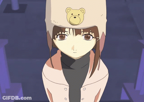 A Girl Wearing A Teddy Bear Hat Looks At The Camera GIF