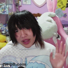 A Girl Wearing A White Shirt With The Word King On The Bottom GIF