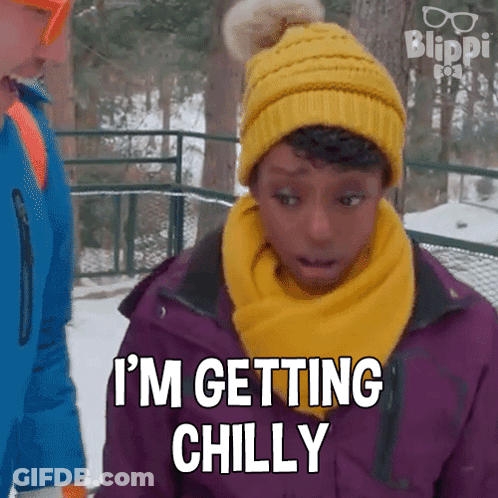 A Girl Wearing A Yellow Hat And Scarf Is Saying I 'M Getting Chilly GIF
