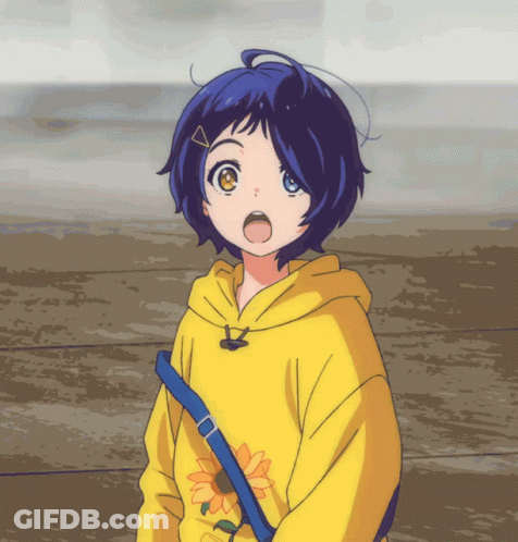 A Girl Wearing A Yellow Hoodie With A Sunflower On The Front GIF
