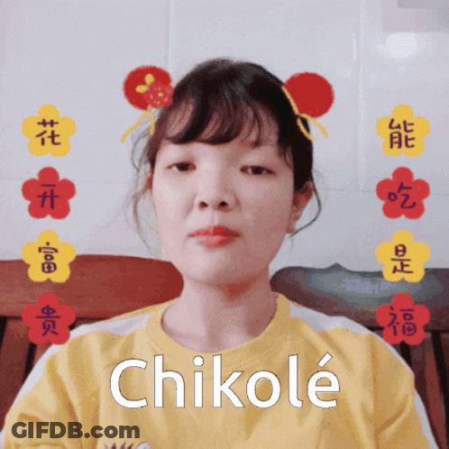 A Girl Wearing A Yellow Shirt With Chikole Written On It GIF
