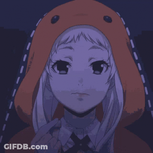 A Girl Wearing An Orange Hoodie Is Smiling And Holding A Bowl Of Popcorn GIF