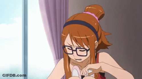 A Girl Wearing Glasses And A Headband Is Looking Down GIF