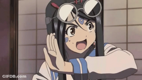 A Girl Wearing Glasses And A Helmet Is Making A Funny Face GIF
