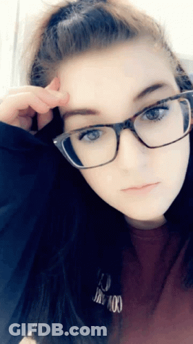 A Girl Wearing Glasses And A Red Shirt That Says I 'M Not Okay GIF