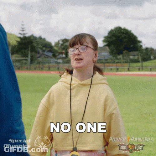 A Girl Wearing Glasses And A Yellow Sweatshirt Says No One GIF