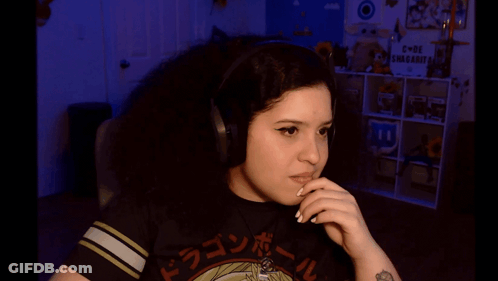 A Girl Wearing Headphones And A Dragon Ball Shirt GIF