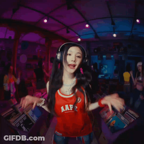 A Girl Wearing Headphones And A Red Shirt That Says Aap On It GIF