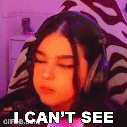A Girl Wearing Headphones Is Making A Funny Face And Saying `` I Can T See '' . GIF