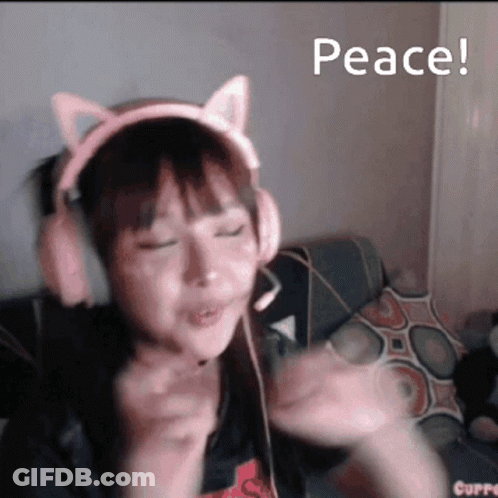 A Girl Wearing Headphones With Cat Ears And The Words Peace GIF
